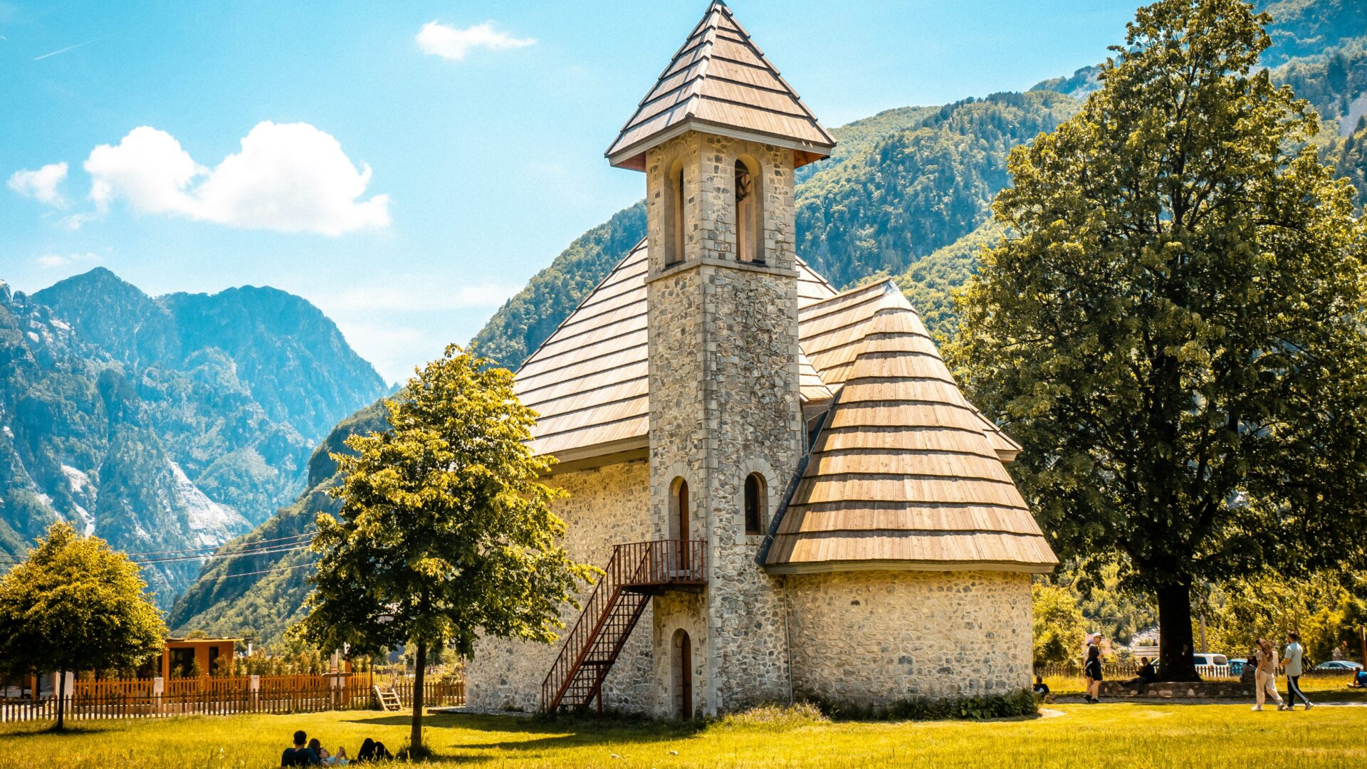 Theth village nestled in a valley surrounded by the peaks of Theth National Park, Albanian Alps