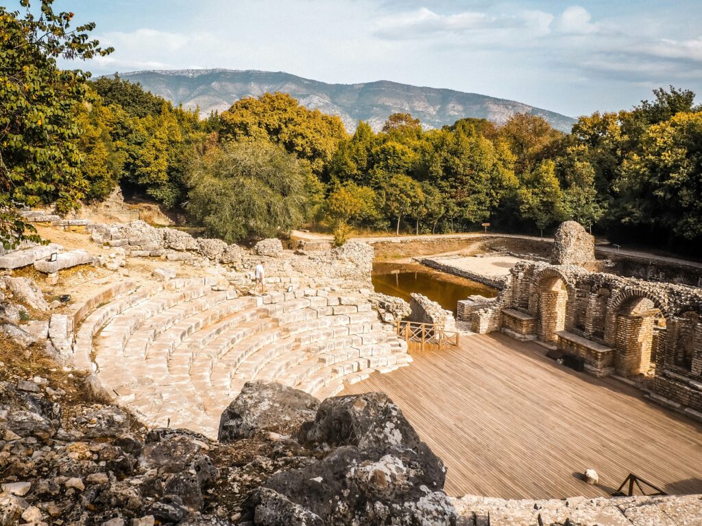 Ancient ruins and forested hillside at Butrint Archaeological Site within Butrint National Park, southern Albania