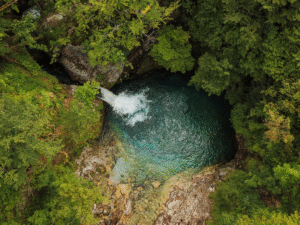 The Blue Eye of Theth, a turquoise natural spring in a limestone gorge in Theth National Park, Albanian Alps