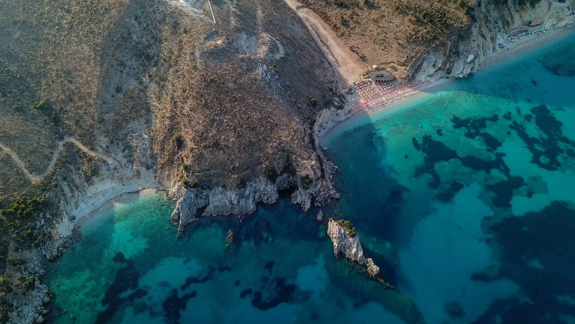 Albanian Riviera coastline with turquoise Ionian water and limestone cliffs, Albania