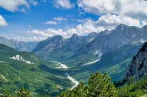 Panoramic view from the Valbona Pass at 1,795 m looking toward Theth valley and the Albanian Alps peaks beyond