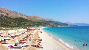 Borsh beach, Albania's longest beach, with grey-white pebbles and calm Ionian water