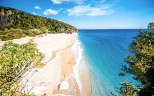 View into Gjipe Canyon from above, with turquoise water at the base, Albanian Riviera